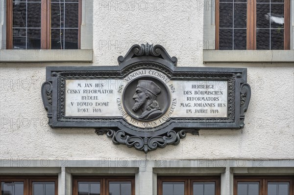 Relief with portrait of Jan Hus on the façade of a medieval house, now the Jan Hus Museum, in the old town centre of Constance, where the Bohemian church reformer spent his last days in freedom. Jan Hus was sentenced to death by burning on 6 July 1415 and executed in Constance. District of Constance, Baden-Württemberg, Germany, Europe