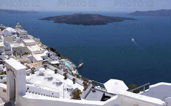 View over the island capital Fira, also Thira, located on the crater rim, in the background volcanic island Nea Kameni Santorini, Cyclades, Greek island, Greece, Europe