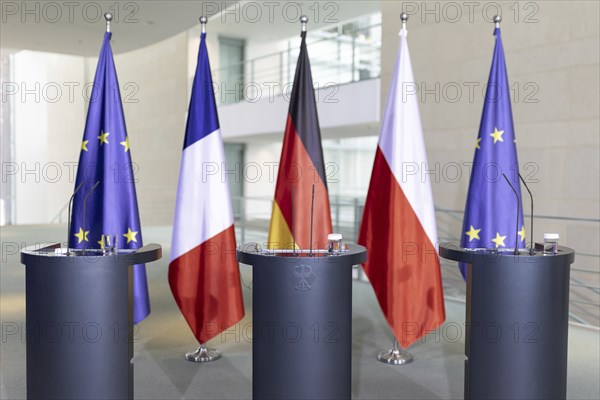 Lecterns and flags, taken during a press conference at the Federal Chancellery in Berlin, 15 March 2024