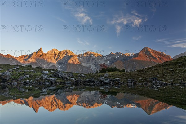 Mountains reflected in a small lake at sunset, autumn, Guggersee, AllgÃ¤u Alps, AllgÃ¤u, Germany, Europe