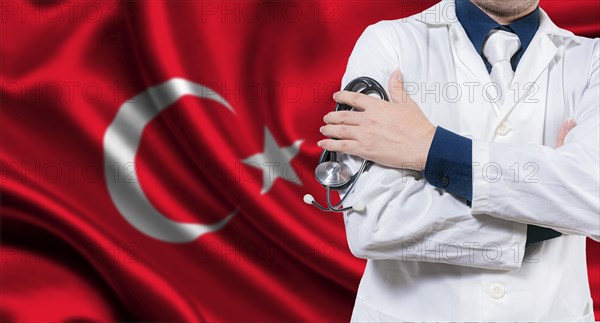 Doctor with stethoscope on Turkish flag. Doctor with crossed arms on Turkish flag, Turkish national health concept