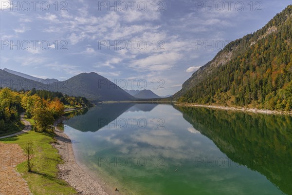 Intake structure at the Sylvenstein reservoir is used for flood protection, dams the Isar, power station, power generation, forest, water reflection, blue sky