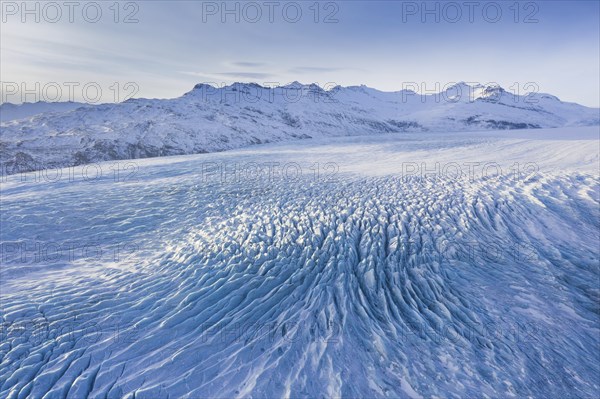 Aerial view over ice tongue Falljökull in winter, one of many outlet glaciers of Vatnajökull, Vatna Glacier, largest ice cap in Iceland, Austurland