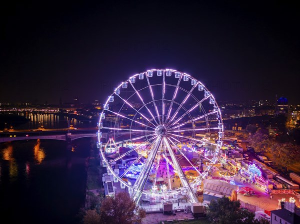 A 55m high illuminated Ferris wheel is the landmark of the fair at the Volksfest grounds on Pieschner Allee in Dresden