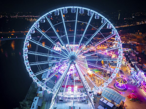 A 55m high illuminated Ferris wheel is the landmark of the fair at the Volksfest grounds on Pieschner Allee in Dresden