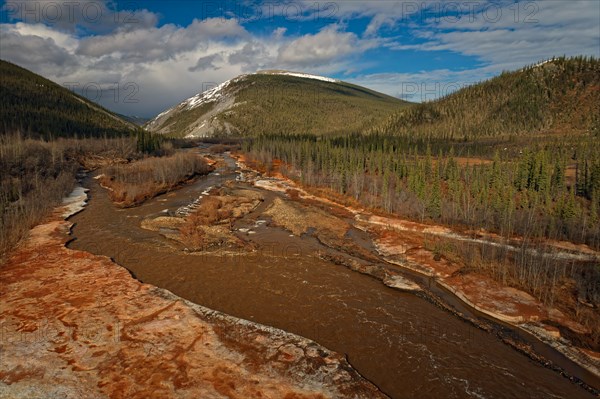 Drone image, view of Engineer Creek, ice break-up, intense red colouring of the water and ice, caused by minerals in the ground, Dempster Highway, Yukon Territory, Canada, North America