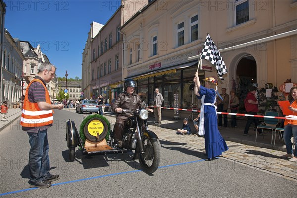 Sebnitz, town festival with classic car rally. The new flower girl Tina Häntzschel starts the motorbikes for the races