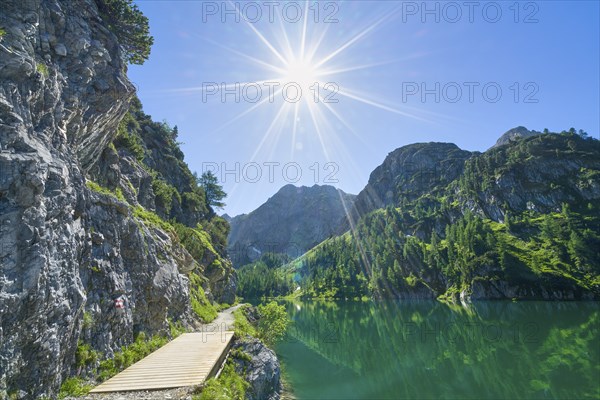 Hiking trail at Tappenkarsee, sun star, mountain lake, Stierkarkopf, Radstätter Tauern, landscape conservation area, Kleinarl, Pongau, Salzburg