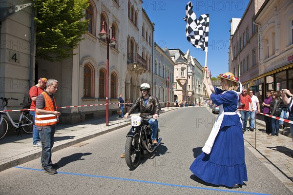 Sebnitz, town festival with classic car rally. The new flower girl Tina Häntzschel starts the motorbikes for the races