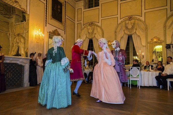 Masquerade ball at Rammenau Baroque Palace, Rammenau Palace in Rammenau near Bischofswerda in the district of Bautzen is one of the most beautiful preserved Baroque country palaces in Saxony. The les danseurs de Sans Souci as guests at the masked ball. With their historical dances, the costumed performers were a highlight of the evening