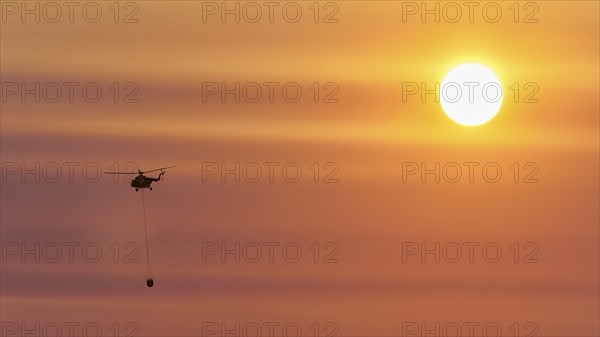 Helicopter, helicopter, fire-fighting helicopter, fire, sunball, sunset, Falassarna, West Crete, Crete, Greece, Europe