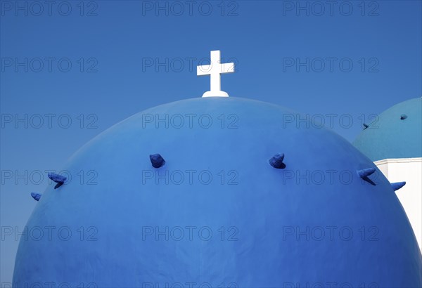 Close-up of blue dome with white cross, Agios Spiridonas, St Spyridon Church, Ia, Oia, Santorini, Greece, Europe