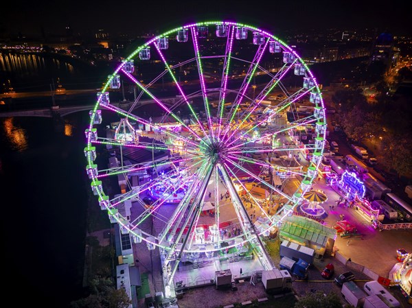 A 55m high illuminated Ferris wheel is the landmark of the fair at the Volksfest grounds on Pieschner Allee in Dresden