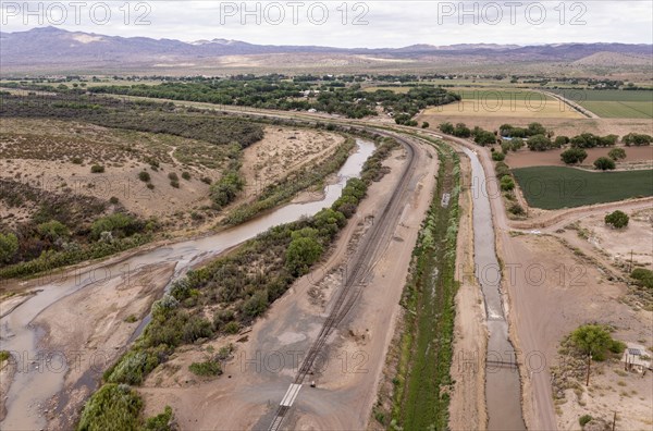 San Acacia, New Mexico, The Rio Grande below the San Acacia Diversion dam. The dam sends water from the Rio Grande into irrigation canals (right of the river) .. Much of the state is experiencing extreme drought, and farmers are not getting all the water they need to grow their crops in the desert