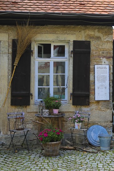 Gomaringen Castle, former bakehouse and washhouse, prison in the castle courtyard, Gustav Schwab Museum, historical building, architecture, small house, windows, shutters, washing utensils, brooms, information board, chairs, still life, plants, Gomaringen, Baden-Württemberg, Germany, Europe