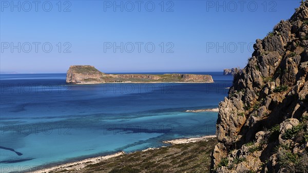 View of a rocky coastline with blue sea and clear sky, Venetian Sea Fortress, Gramvoussa, Gramvoussa Peninsula, Pirate Bay, Balos, Lagoon, Northwest Crete, Crete, Greek Islands, Greece, Europe