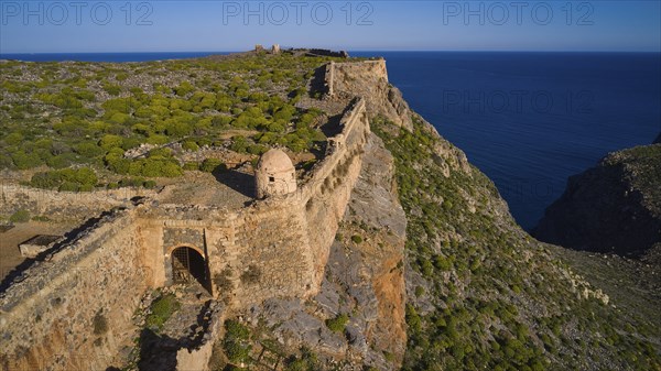 Drone shot, Part of a historic fortress on a cliff overlooking the Blue Clipper, Venetian sea fortress, Gramvoussa, Gramvoussa peninsula, Pirate Bay, Balos, Lagoon, Northwest Crete, Crete, Greek Islands, Greece, Europe