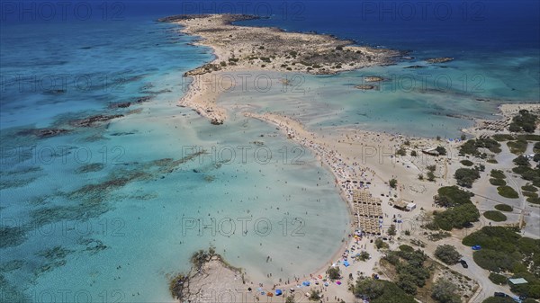 Overtourism, Tourists on the beach, Sunshades, A beach with turquoise waters, ideal for a relaxing holiday surrounded by nature, Elafonissi, Lagoon, Southwest tip of Crete, Crete, Greek Islands, Greece, Europe