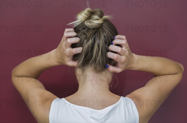 Great concept of allergy and skin diseases, young woman scratching her head