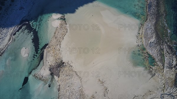 Drone shot, aerial view of water, sand and rocks with clear turquoise water and natural shapes, Gramvoussa, Gramvoussa Peninsula, Pirate Bay, Balos, Lagoon, Northwest Crete, Crete, Greek Islands, Greece, Europe