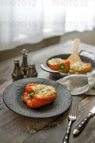 Roasted goat cheese stuffed bell peppers on a table