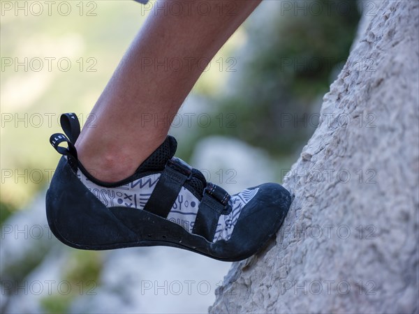 Close-up, friction climbing shoe standing on a rock slab, Belove Stene climbing area, island of Krk, Croatia, Europe