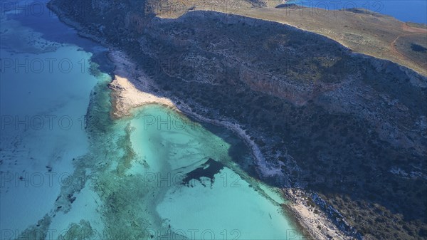 Drone shot, aerial view of a coastline with blue water and rocky shore, natural and idyllic view, Gramvoussa, Gramvoussa peninsula, Pirate Bay, Balos, lagoon, north-west Crete, Crete, Greek Islands, Greece, Europe