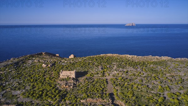 Drone shot, ruins on cliffs by the sea with sweeping views and lush vegetation to the horizon, Venetian sea fortress, Gramvoussa, Gramvoussa peninsula, Pirate Bay, Balos, lagoon, north-west Crete, Crete, Greek Islands, Greece, Europe