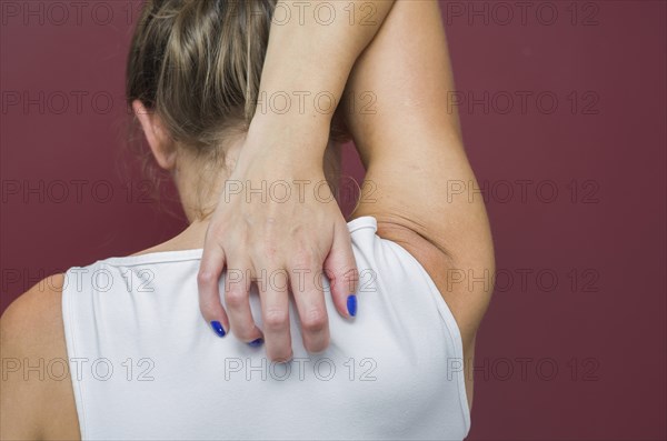 Great concept of allergy and skin diseases, young woman scratching herself