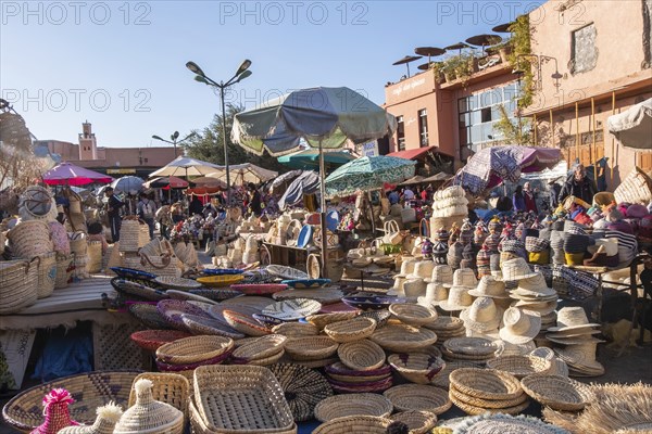 Straw utensils for sale in a souk in the Medina in Marrakesh Morocco