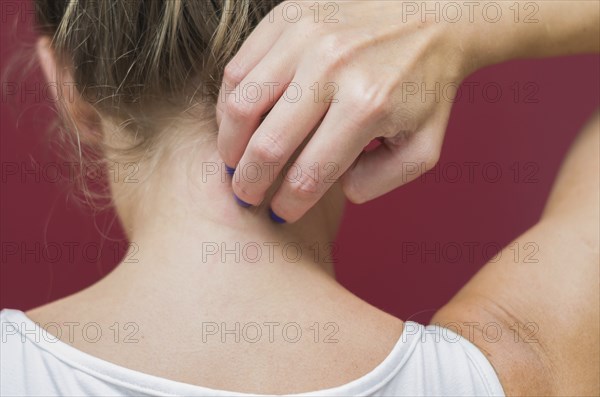 Great concept of allergy and skin diseases, young woman scratching herself