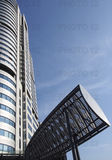 Leeds, west yorkshire, united kingdom, 16 july 2019: close up of bridgewater tower in whitehall place leeds west yorkshire and wind deflectors put in place to manage turbulence on the road