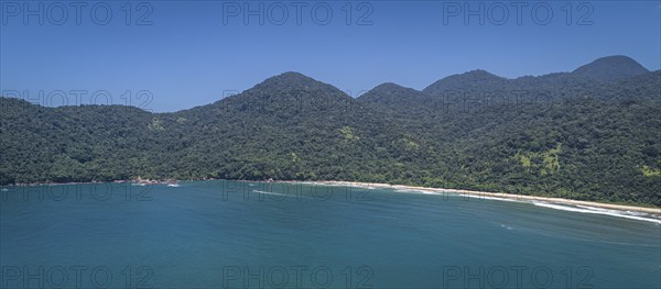 Panoramic aerial view to wonderful Green Coast shoreline and mountains covered with Atlantic Forest, Picinguaba, Brazil, South America