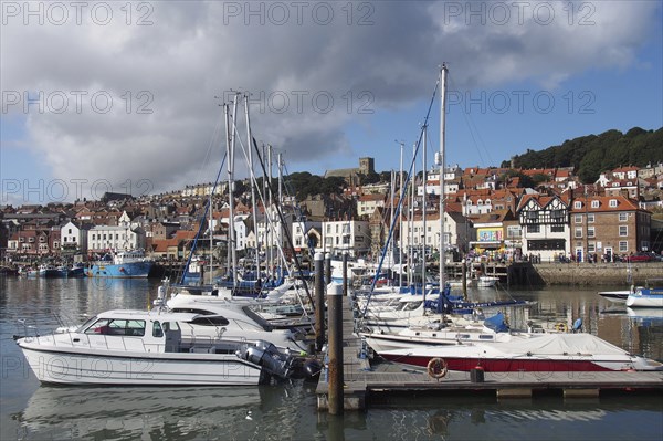 Scarborough, North Yorkshire, United Kingdom, 12 September 2022 : leisure boats and yachts moored in the marina area of scarborough harbour with the town in the distance, Europe