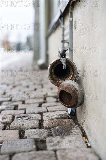 Disused pipe coupling formerly used to receive beer from tank truck