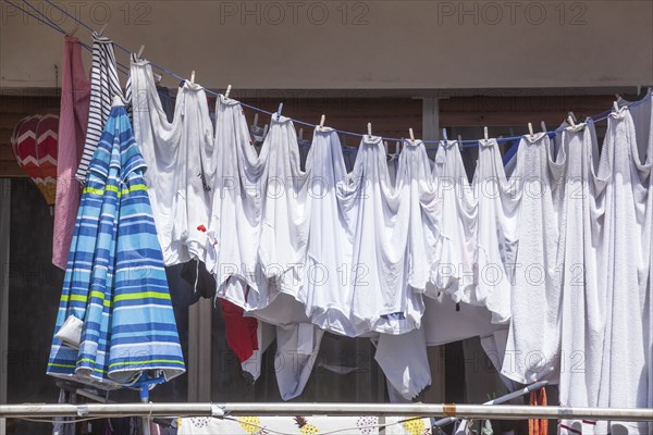 Clothesline with hanging laundry on a balcony, Diepholz, Lower Saxony, Germany, Europe