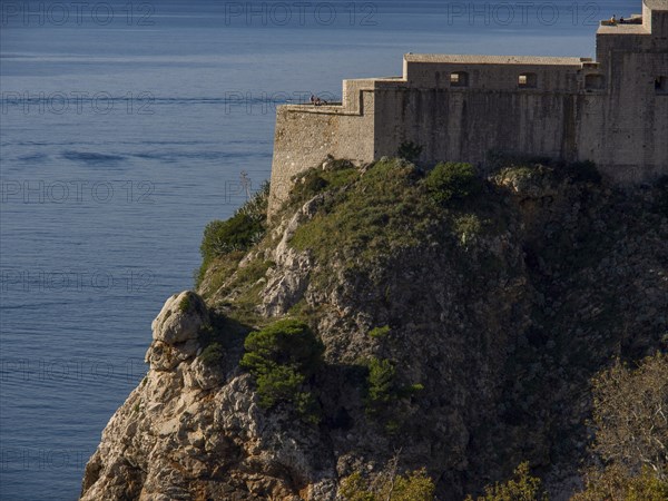 Historic castle on a rock overlooking the calm sea, dubrovnik, Mediterranean, Croatia, Europe