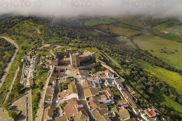 Monsaraz drone aerial view on the clouds in Alentejo, Portugal, Europe