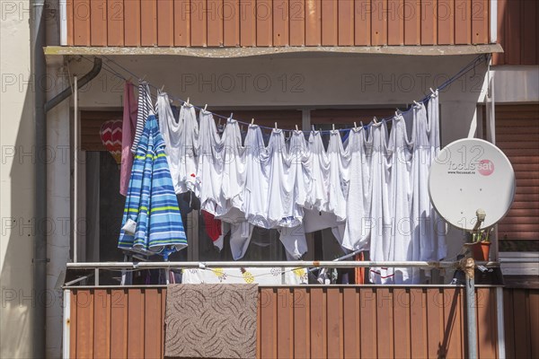 Clothesline with hanging laundry on a balcony, Diepholz, Lower Saxony, Germany, Europe