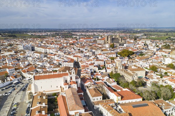 Evora drone aerial view on a sunny day with historic buildings city center and church in Alentejo, Portugal, Europe