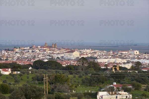 Evora city historic buildings and church view at sunset from a viewpoint on the outside in Alentejo, Portugal, Europe