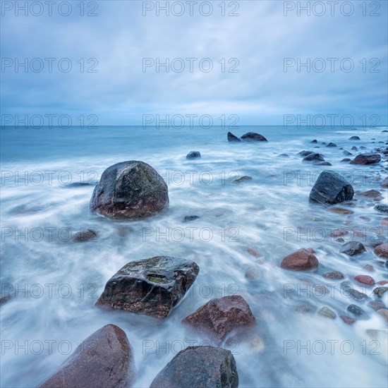 Stormy Baltic Sea in winter, boulders in the surf, near Rerik, Mecklenburg-Western Pomerania, Germany, Europe