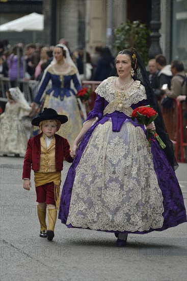 Fallas festival, parade, flower offering, at Plaza de la Virgen de los Desamparados, Valencia, Spain, Europe