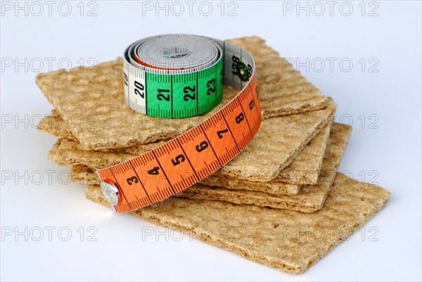 Crispbread and measuring tape/ crispbread