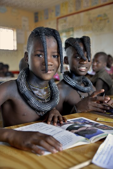 Girls, Himba pupils, sitting in a classroom at the Omohanga Primary School, Himba school, Omohanga, Kaokoland, Kunene, Namibia, Africa