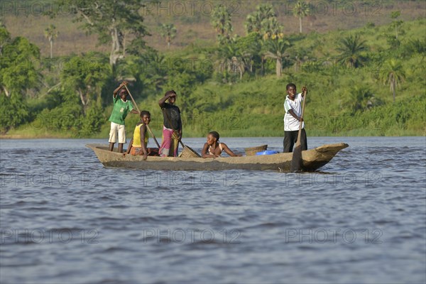 Fisher family on a pirogue on the Congo River, near Tshumbiri, Bandundu Province, Congo, Africa