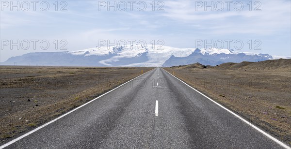 Road, glacier tongues and mountains, glacier tongues at Vatnajökull glacier, Vatnajökull National Park, Austurland, Iceland, Europe