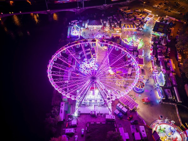 A 55m high illuminated Ferris wheel is the landmark of the fair at the Volksfest grounds on Pieschner Allee in Dresden