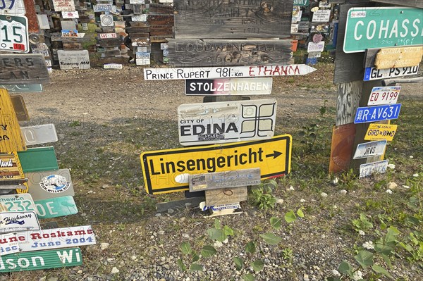 Place and traffic signs in a forest of signs, Linsengericht in Hesse, Watson Lake, Yukon Territory, Alaska Highway, Canada, North America