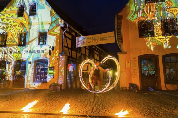 Midsummer Night's Dreams Projections by Claudia Reh, fire artist Vivi Sol enchants with her flames